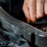 cropped-shot-of-auto-mechanic-checking-automobile-PR973E2-1.jpg